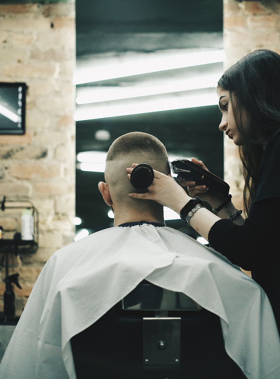 Stylist cutting a man's hair