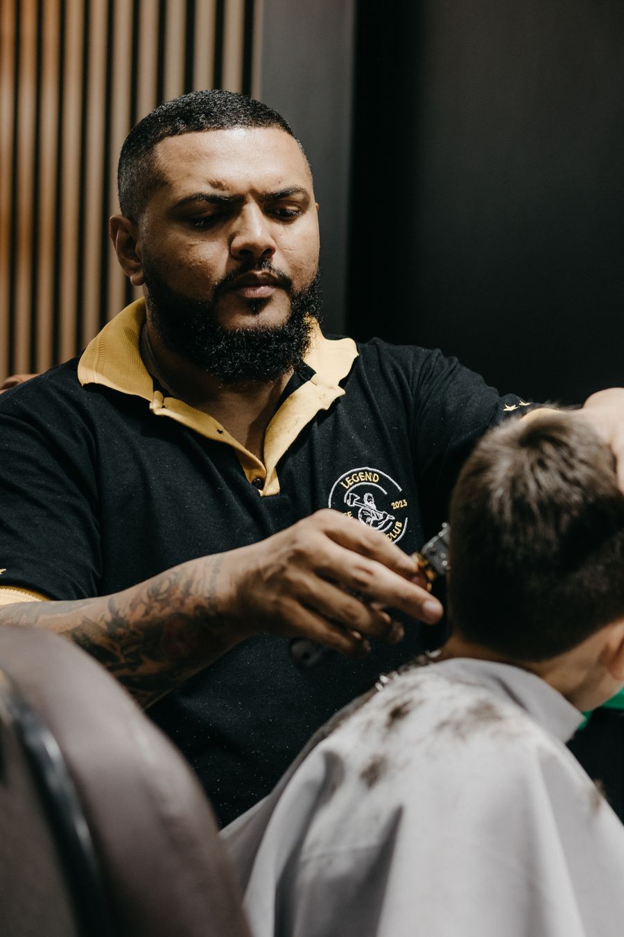 Young boy having his hair cut